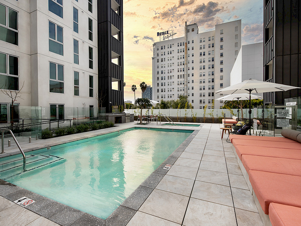 Wilco Apartments in Westlake, CA - Sparkling Swimming Pool Surrounded By Loung Seating and Lush Landscaping